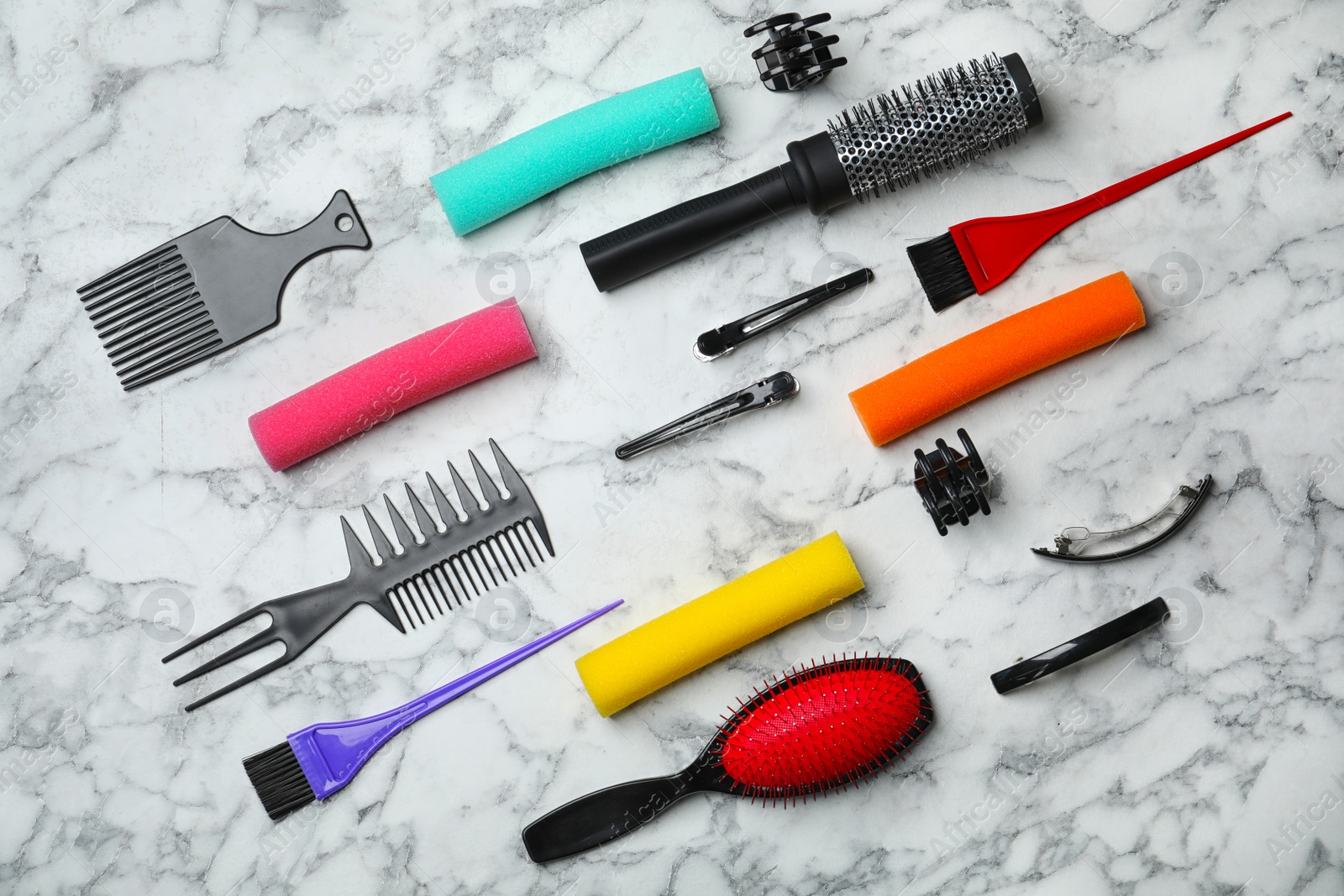 Photo of Professional hairdresser set on light background