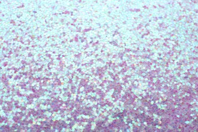 Photo of Beautiful shiny lilac glitter as background, closeup