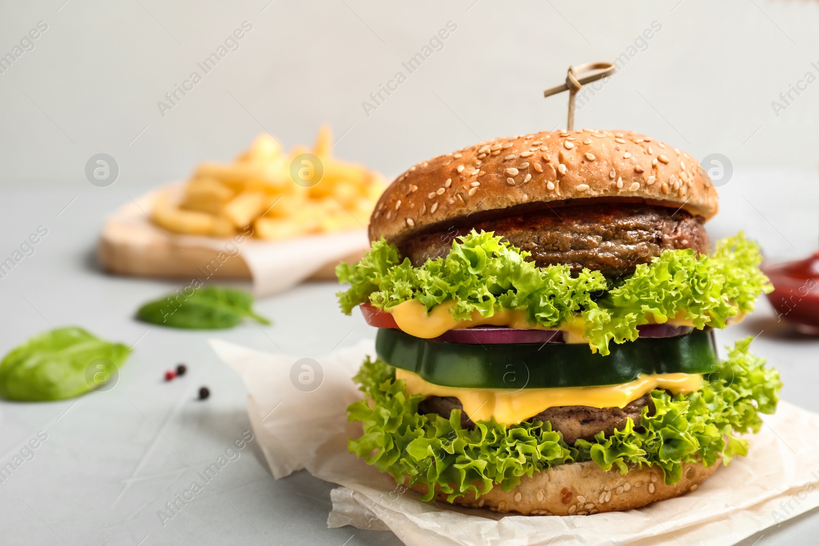 Photo of Tasty fresh burger on table. Space for text