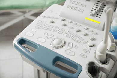 Photo of Ultrasound control panel with ultrasonic transducers indoors, closeup. Medical equipment