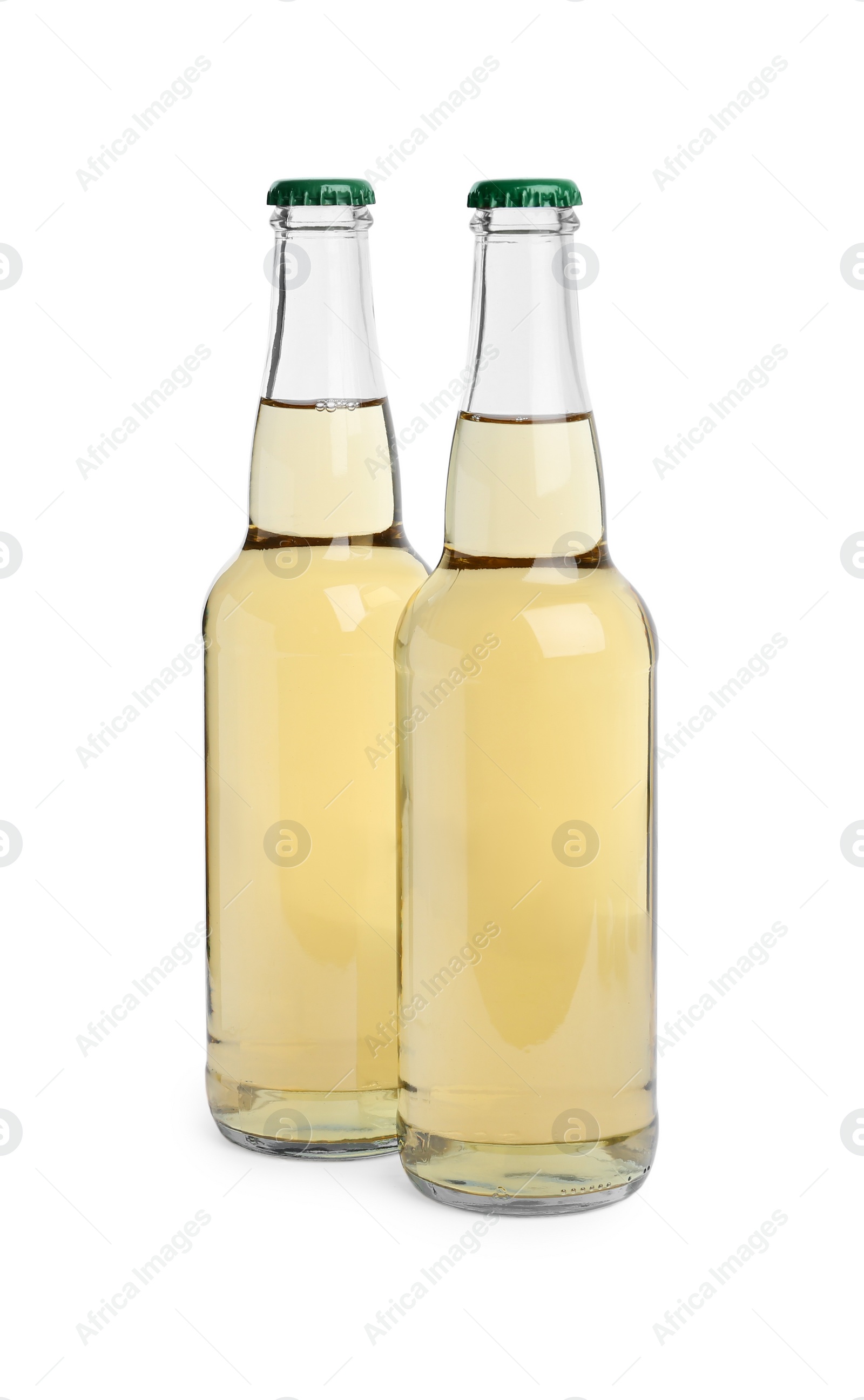 Photo of Bottles of delicious apple cider isolated on white