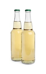 Photo of Bottles of delicious apple cider isolated on white