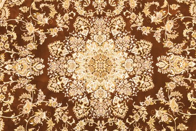 Soft brown carpet with beautiful pattern as background, top view