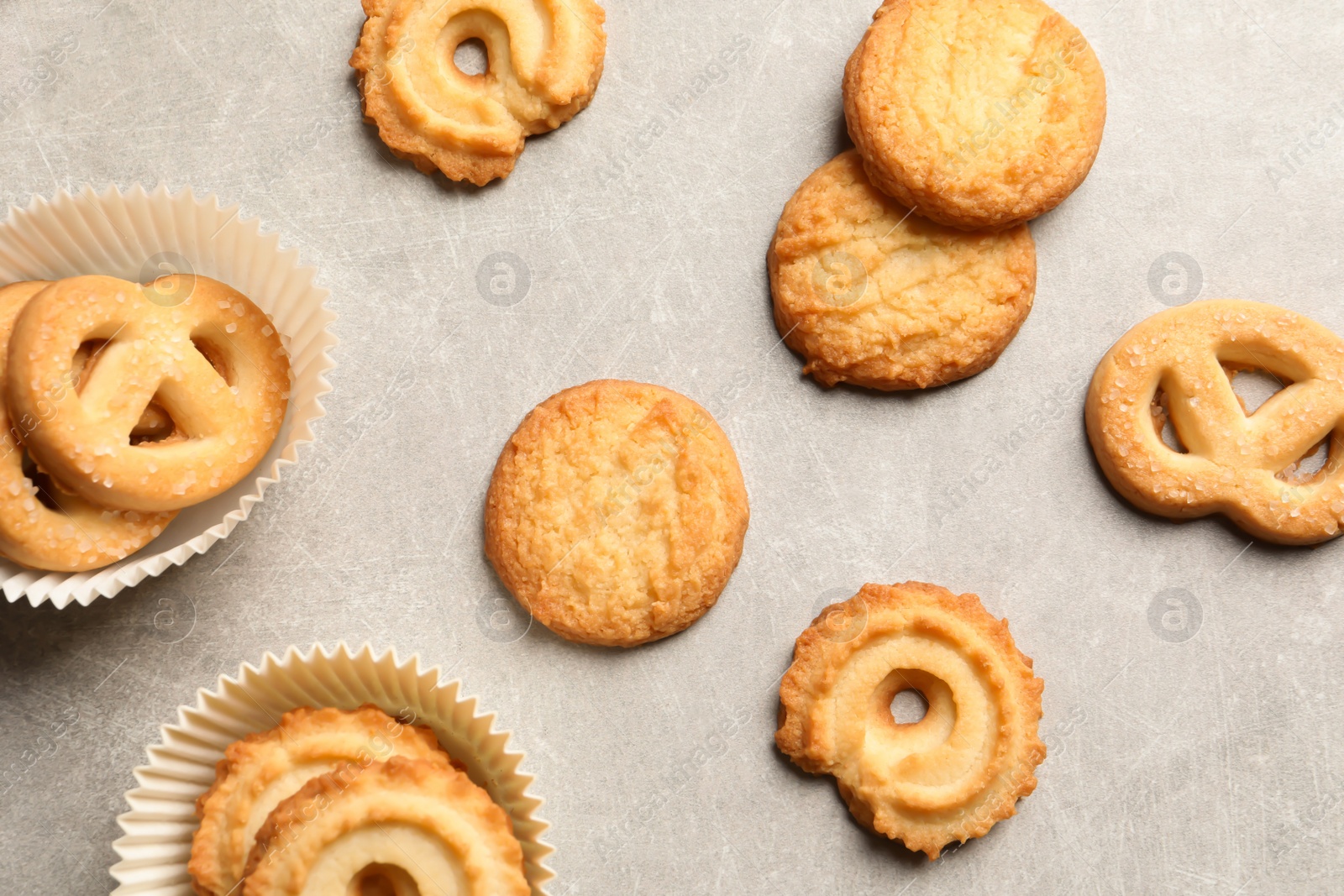 Photo of Tasty Danish butter cookies on grey background, flat lay