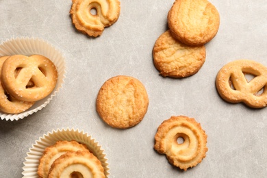 Photo of Tasty Danish butter cookies on grey background, flat lay