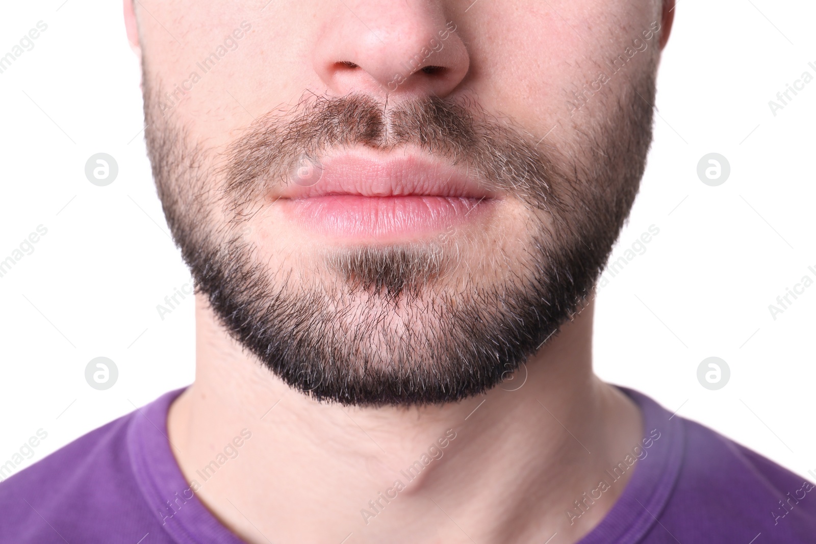 Photo of Young man on white background, closeup. Focus on lips