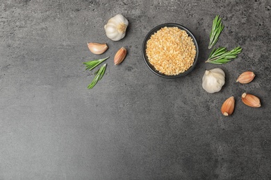 Flat lay composition with garlic products on grey background