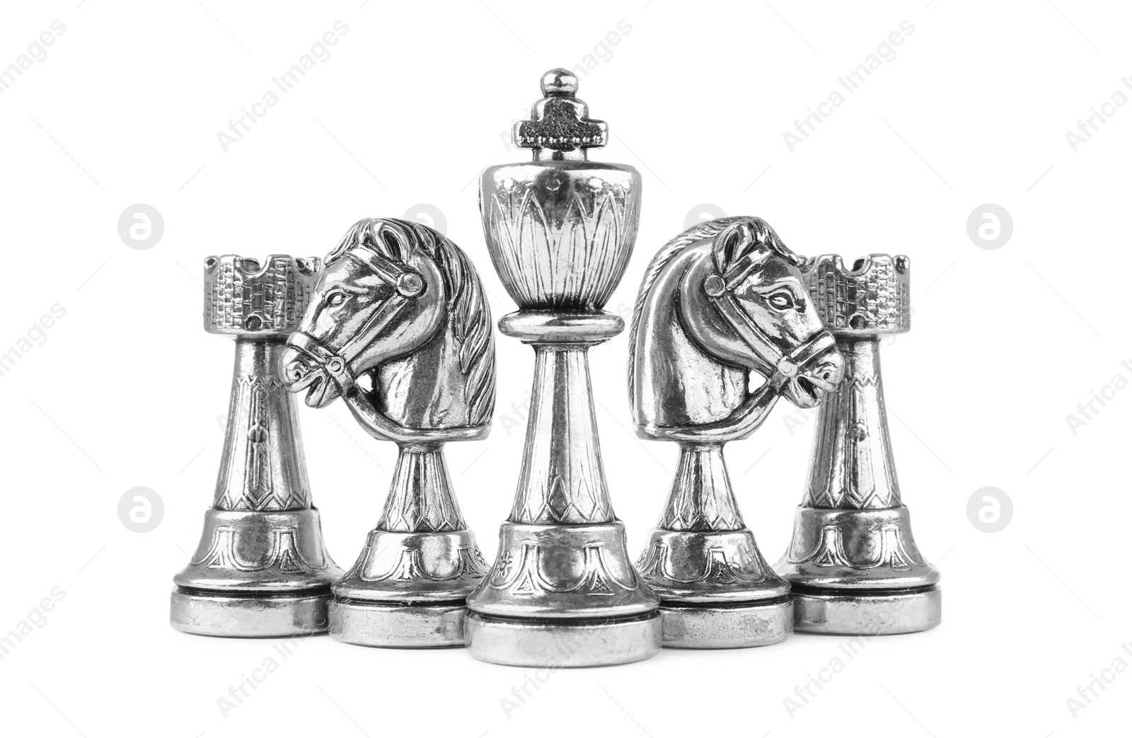 Photo of Set of silver chess pieces on white background