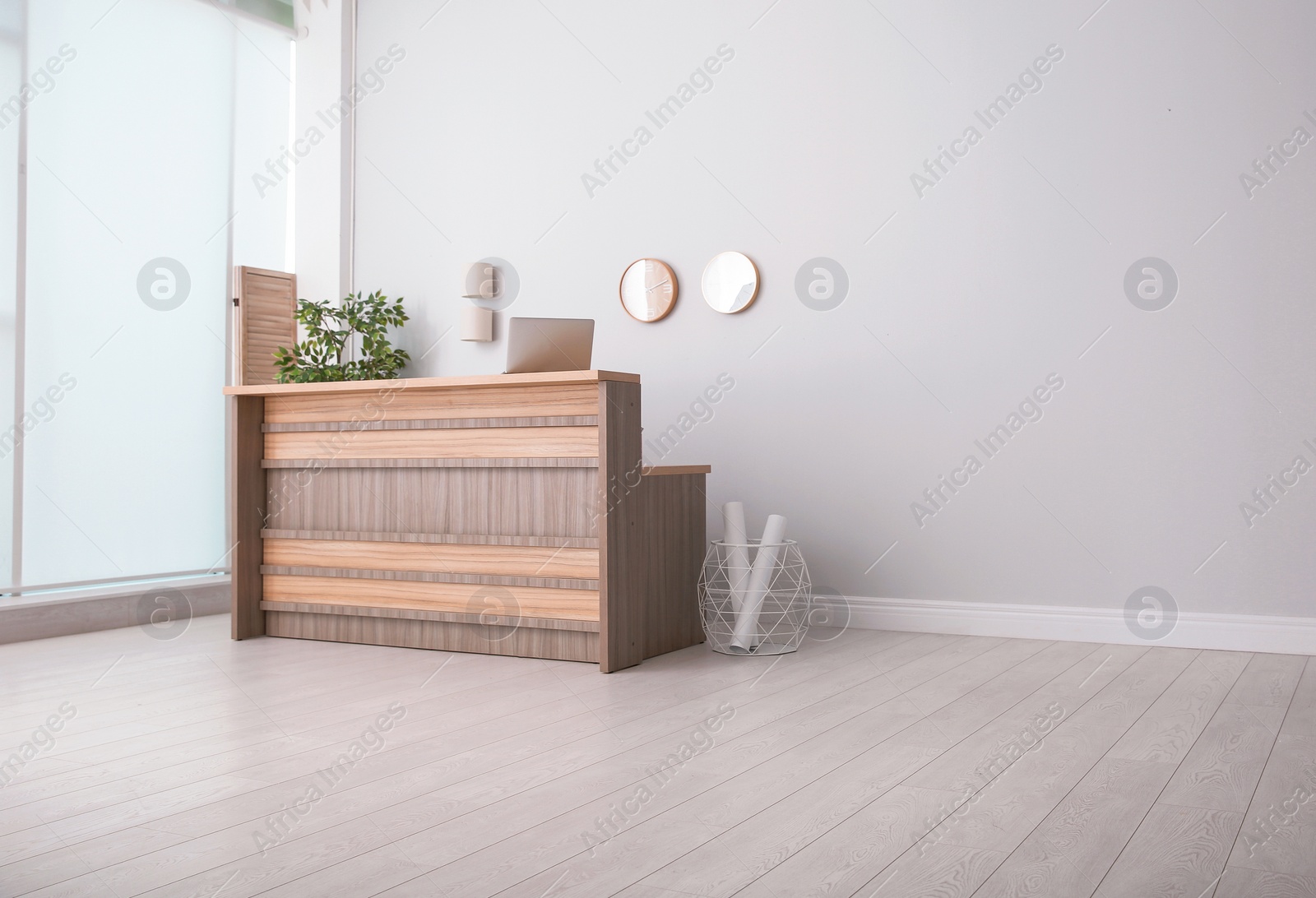 Photo of Hotel lobby interior with wooden reception desk