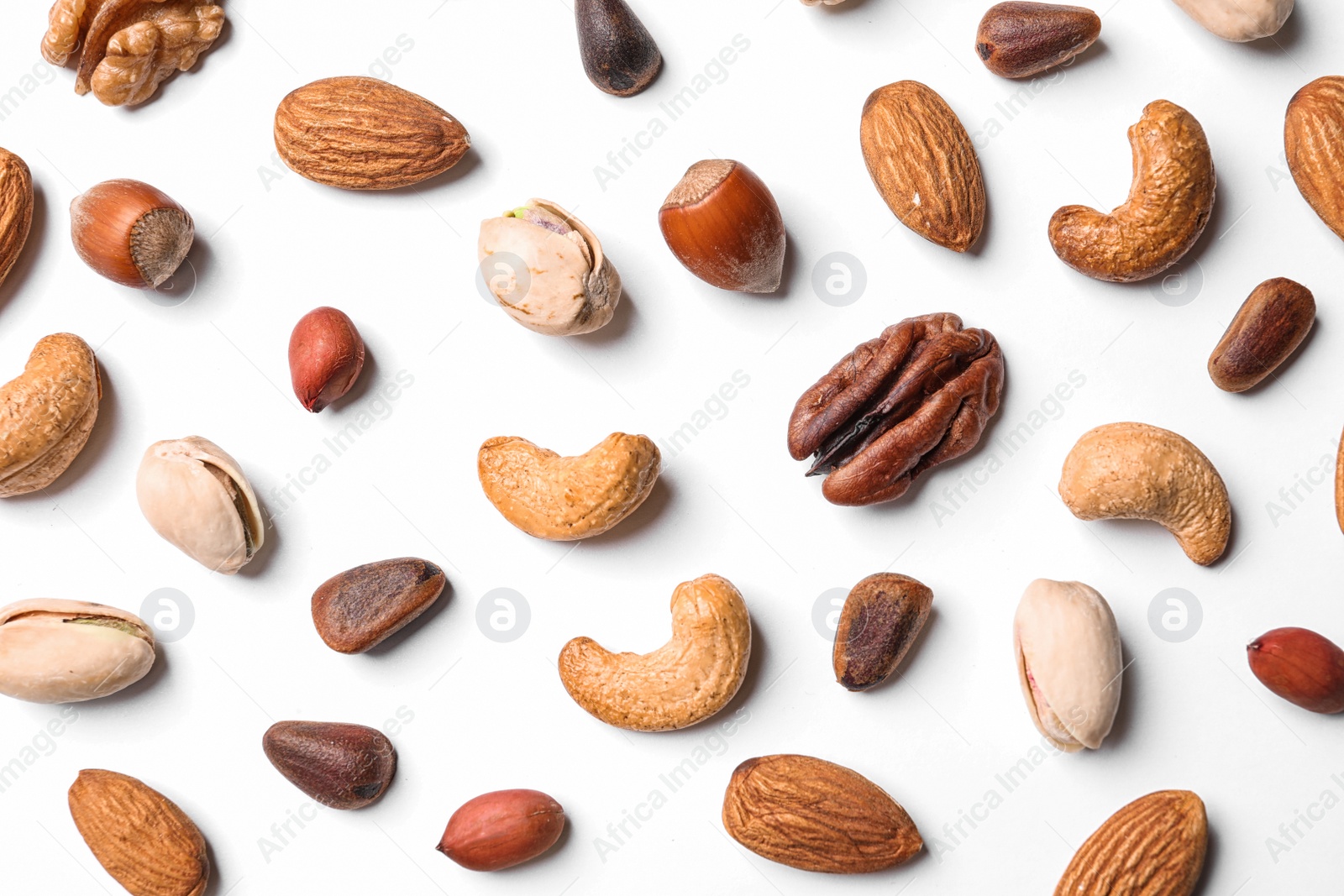 Photo of Composition with organic mixed nuts on white background, top view