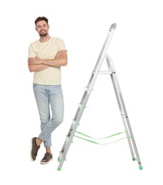 Photo of Young handsome man near metal ladder on white background
