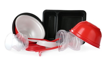 Pile of different plastic items on white background