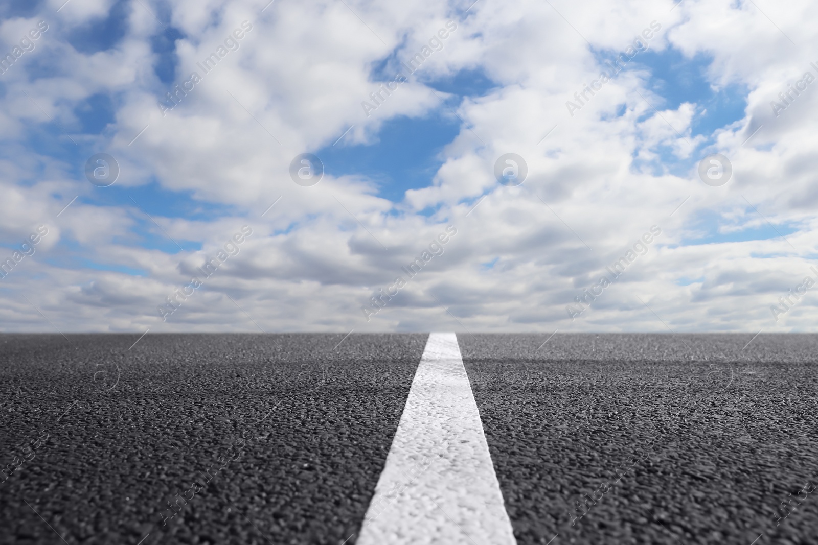 Image of View of empty asphalt road on sunny day