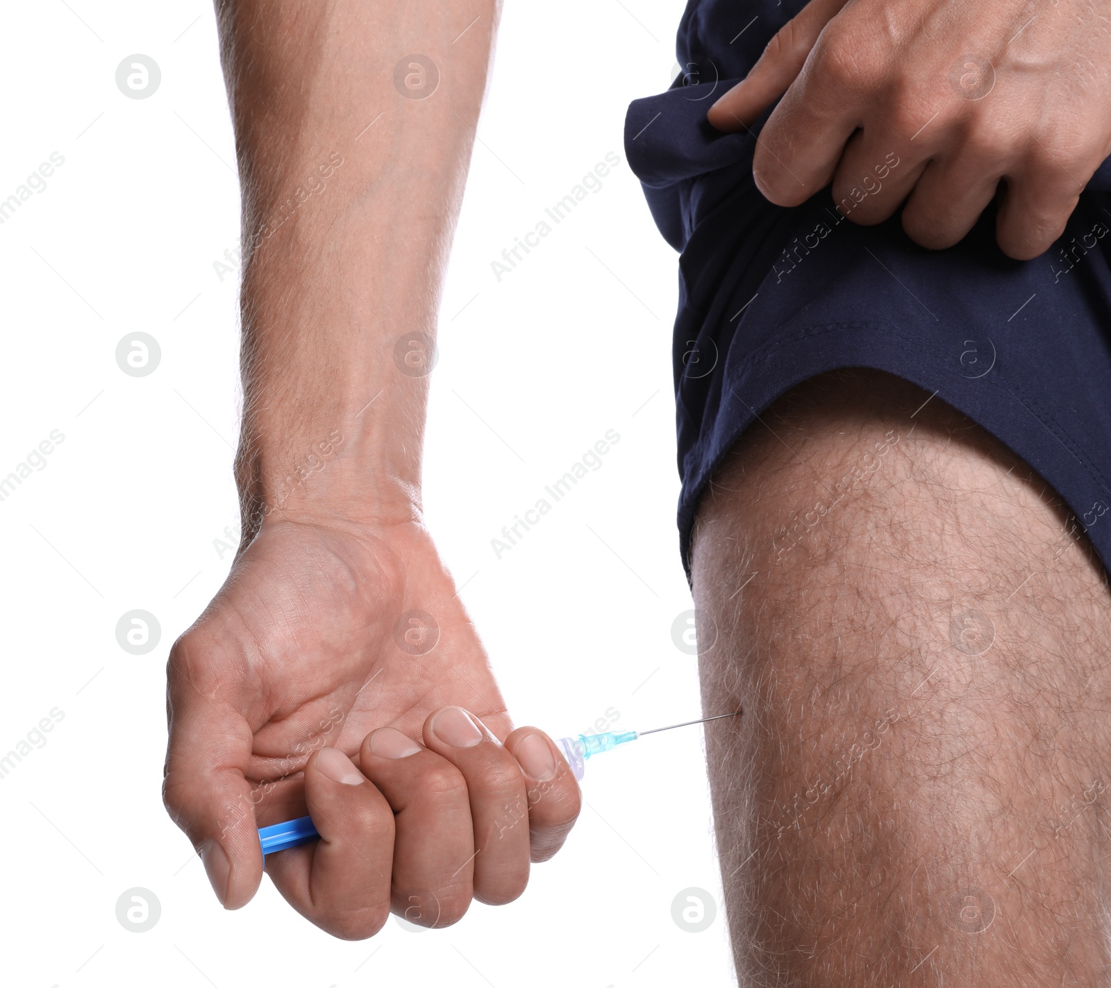 Photo of Athletic man injecting himself on white background, closeup. Doping concept