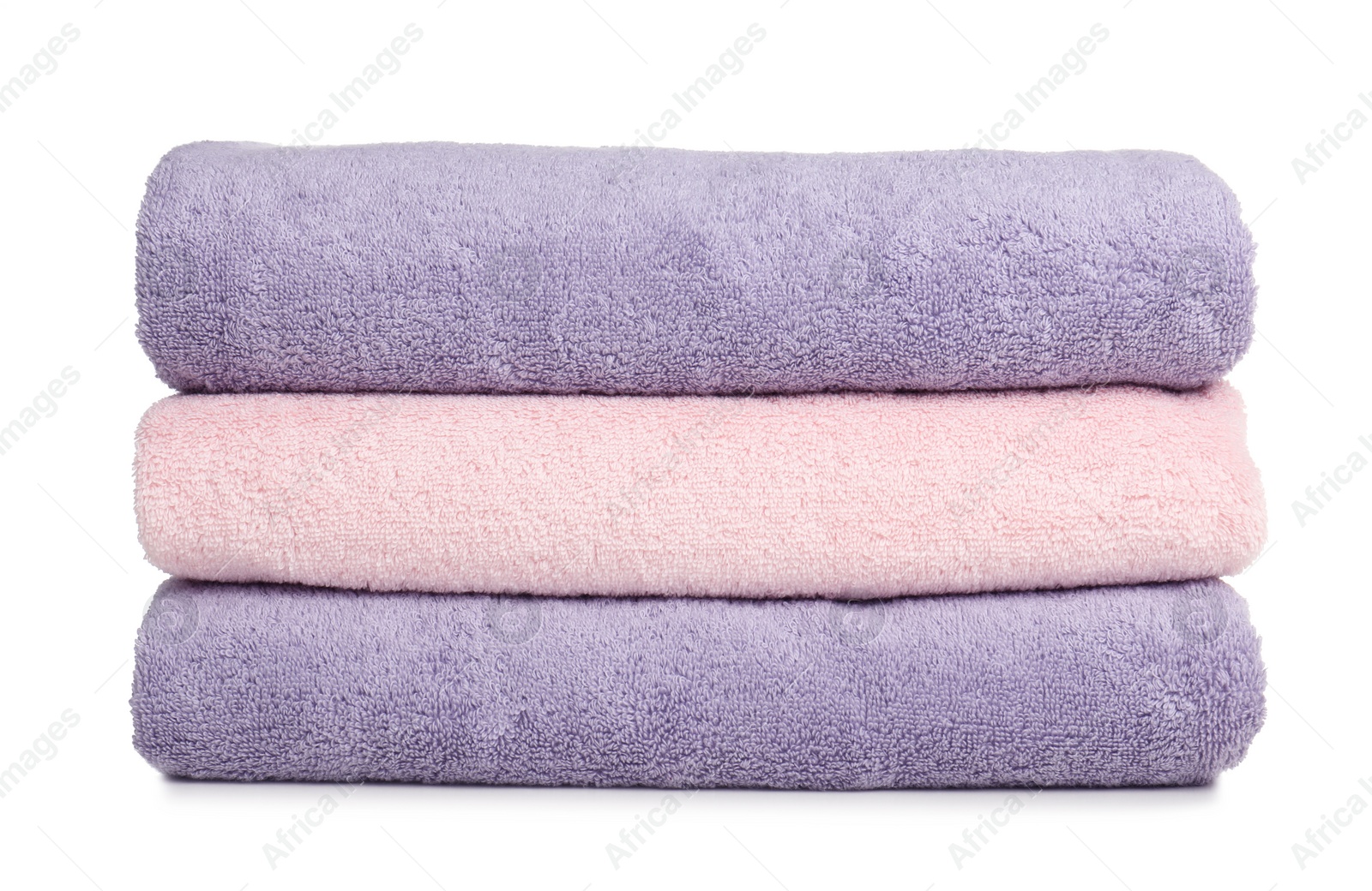 Photo of Folded soft terry towels on white background