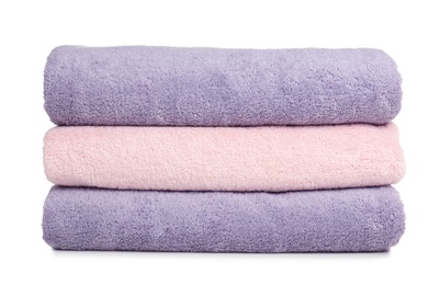 Photo of Folded soft terry towels on white background