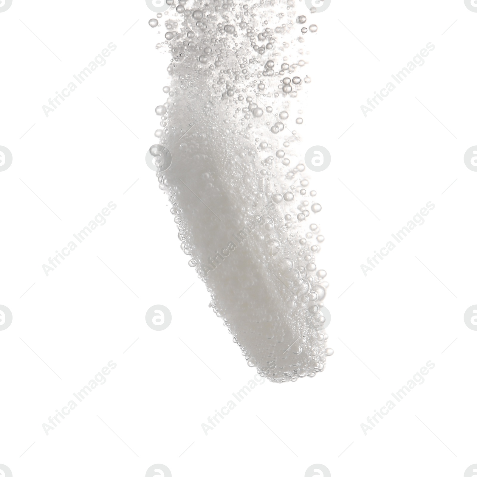 Photo of Effervescent pill dissolving in water on white background, closeup