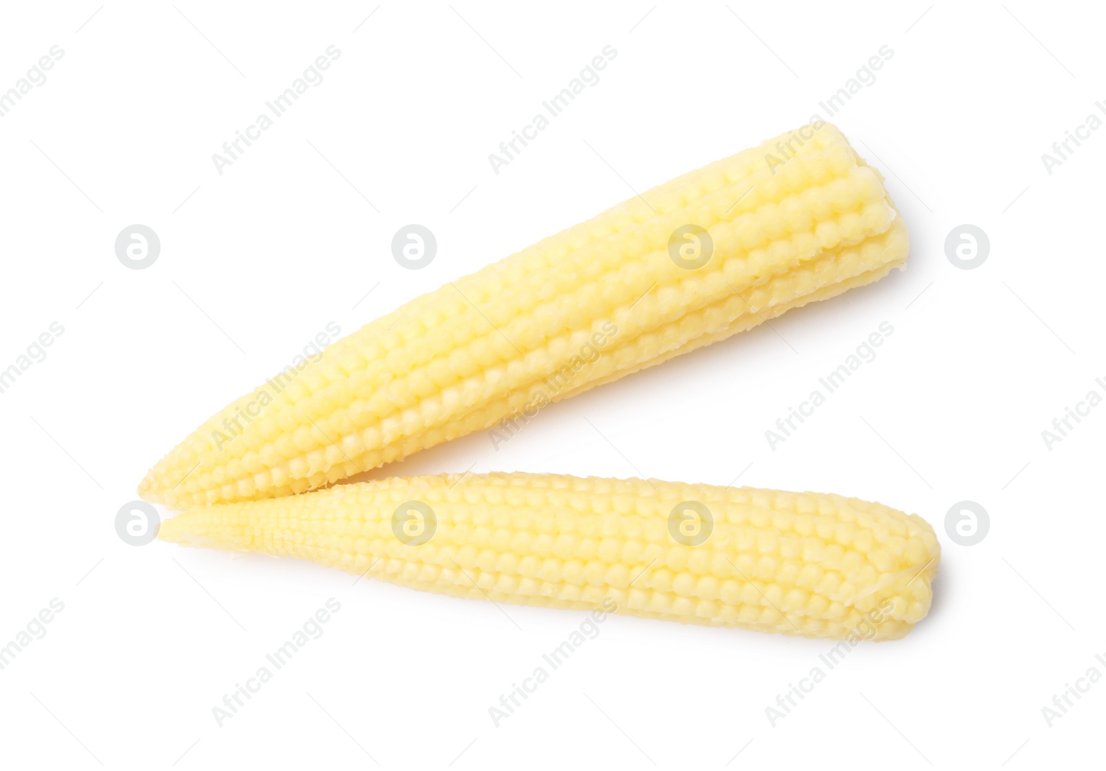 Photo of Tasty fresh baby corns isolated on white, top view