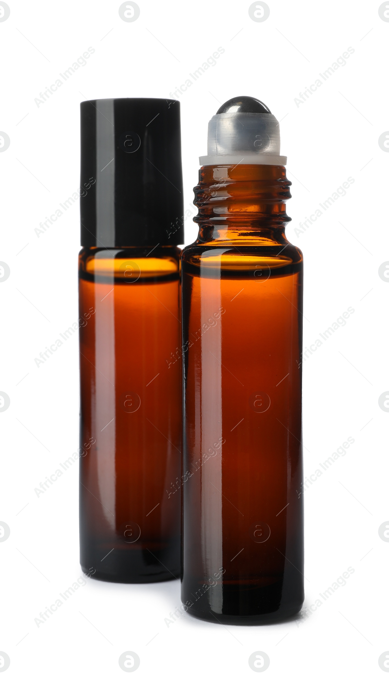 Photo of Bottles of essential oil isolated on white