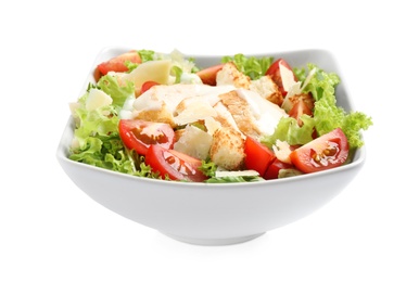 Delicious fresh Caesar salad in bowl on white background 