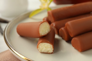 Photo of Glazed curd cheese bars on table, closeup