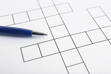 Photo of Pen on blank crossword, closeup. Space for text