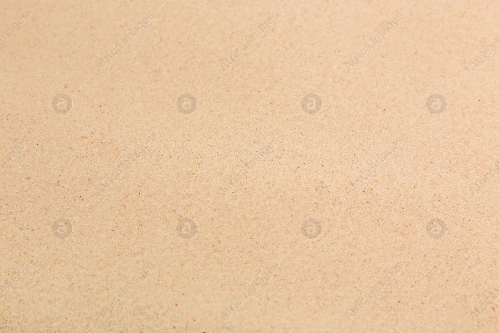 Photo of Dry sand on beach as background, closeup