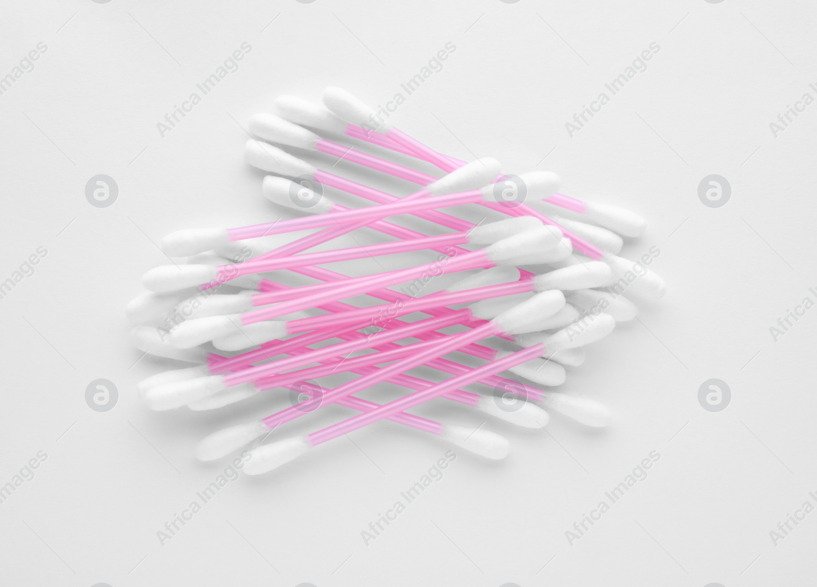 Photo of Clean cotton buds isolated on white, top view