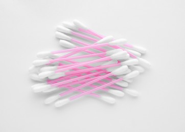 Clean cotton buds isolated on white, top view