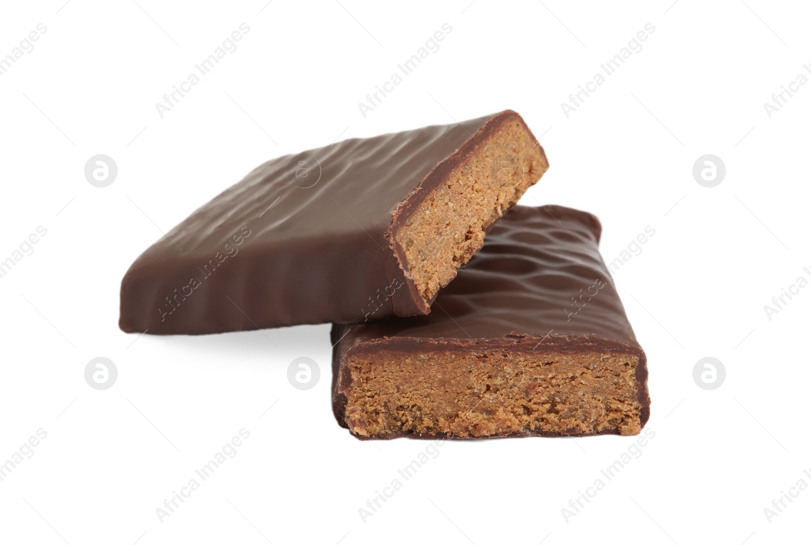 Photo of Halves of tasty chocolate glazed protein bar on white background