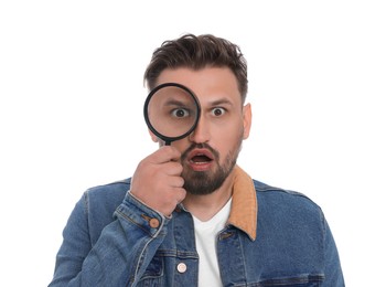 Emotional man looking through magnifier on white background