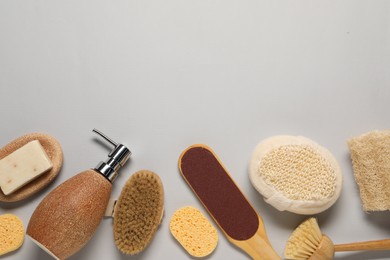 Photo of Bath accessories. Flat lay composition with personal care tools on light grey background, space for text