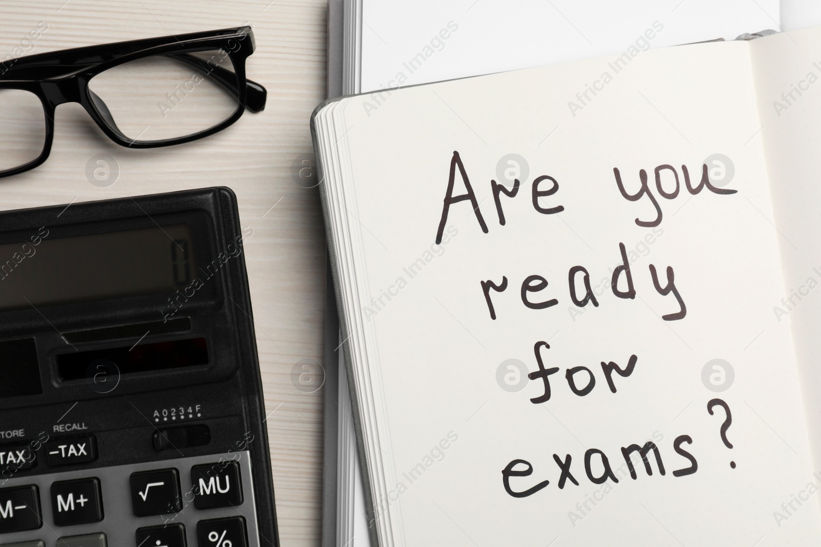 Photo of Notebook with question Are You Ready For Exams? on white wooden table, flat lay