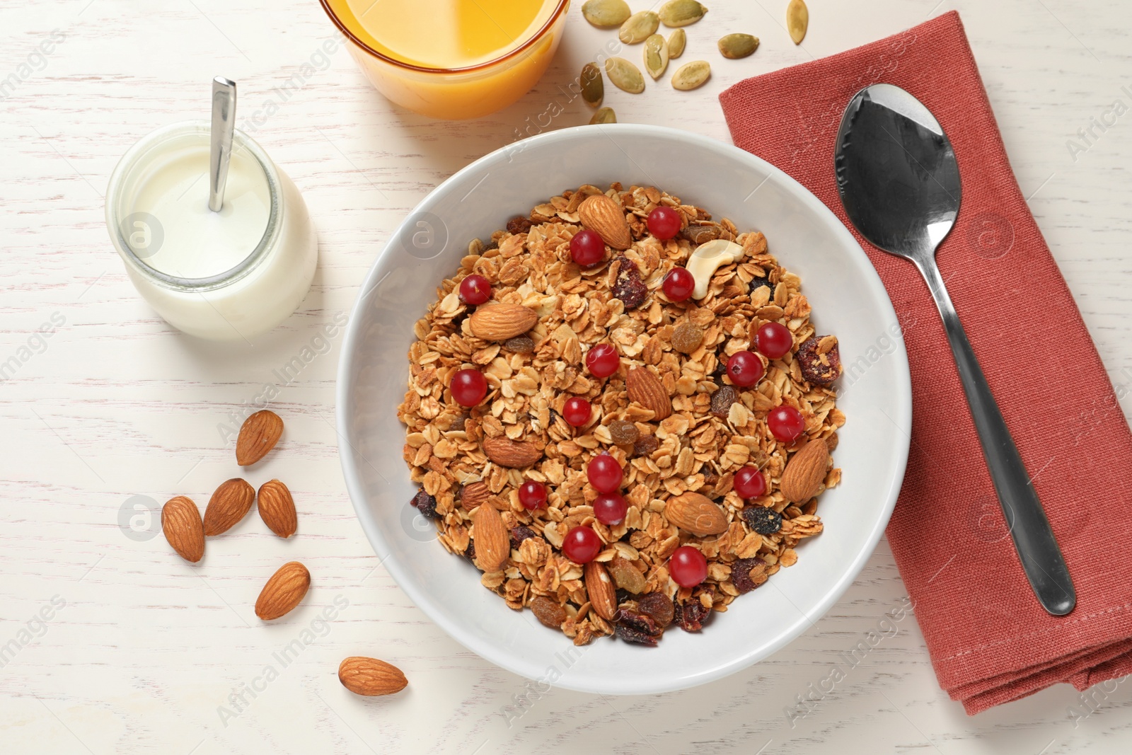 Photo of Tasty healthy breakfast served on white wooden table, flat lay