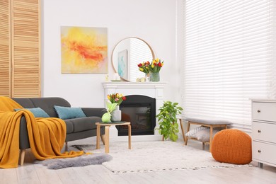 Photo of Beautiful Easter decorations and furniture in stylish room