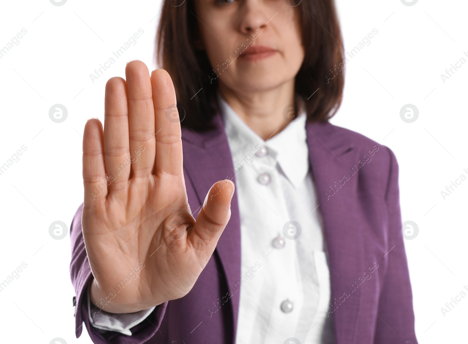 Photo of Woman in suit showing gesture stop on white background, closeup