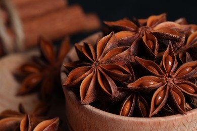 Photo of Aromatic anise stars in bowl, closeup view