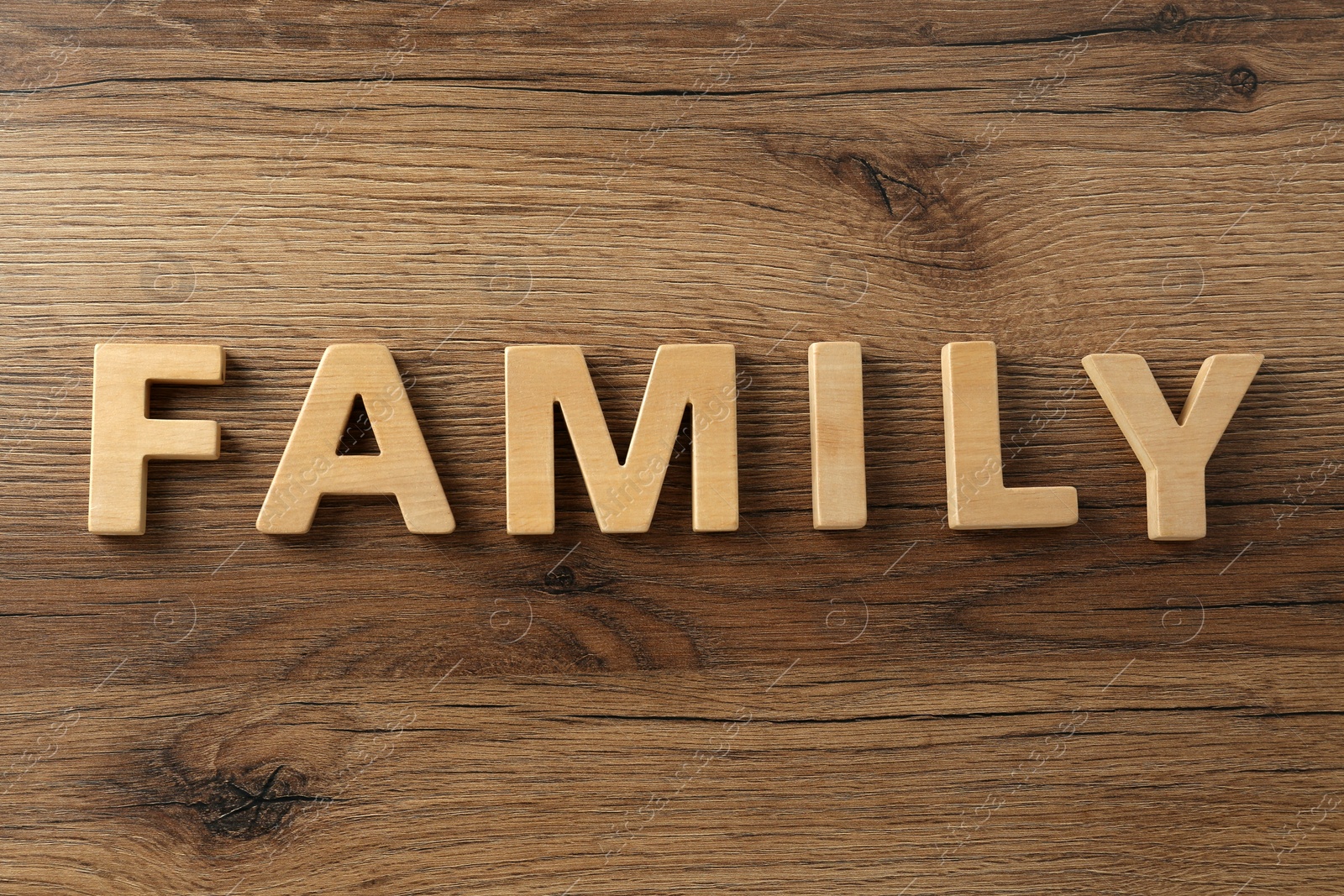 Photo of Word Family made with wooden letters on table, flat lay