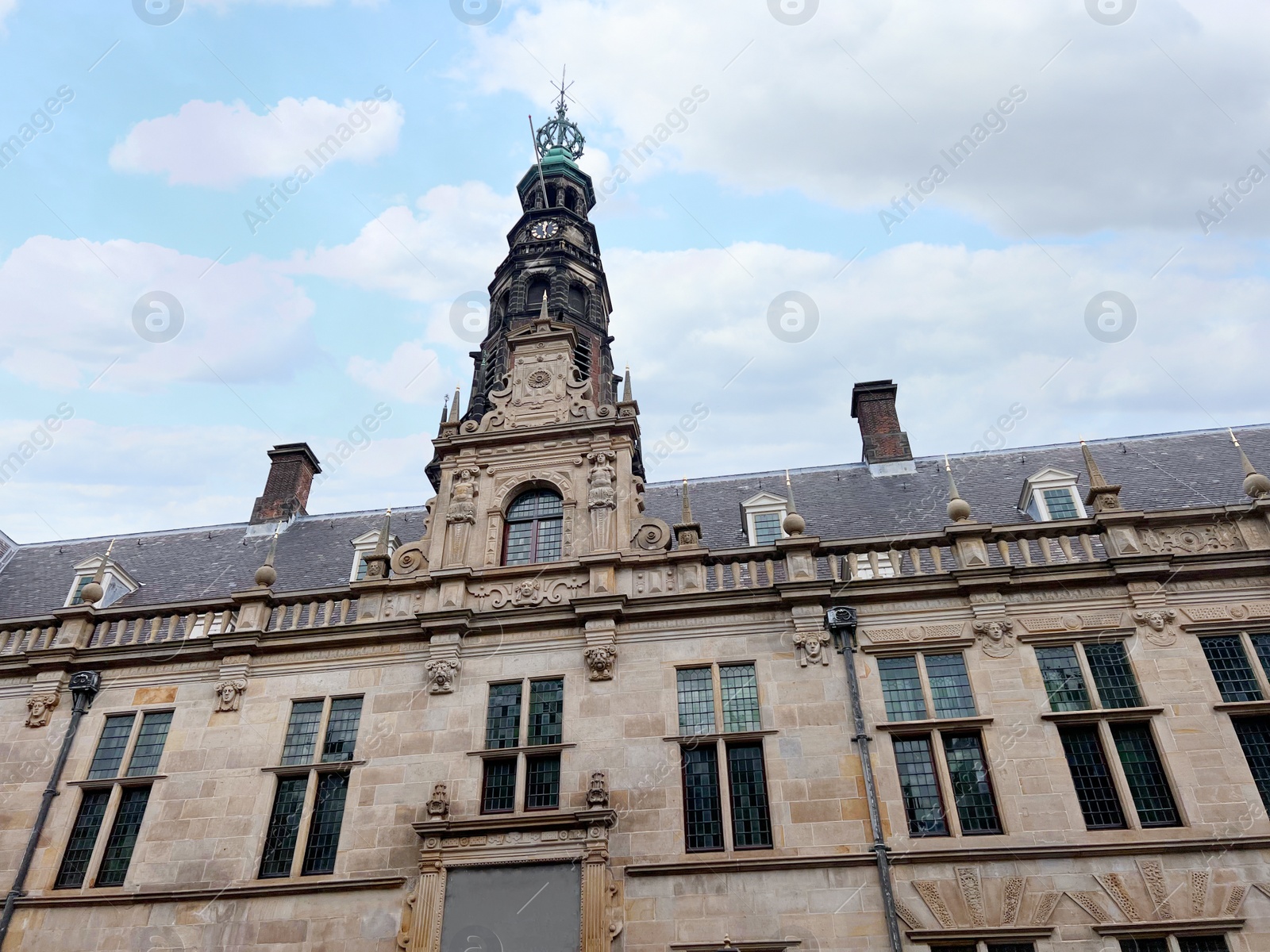 Photo of Beautiful old building against cloudy sky, low angle view