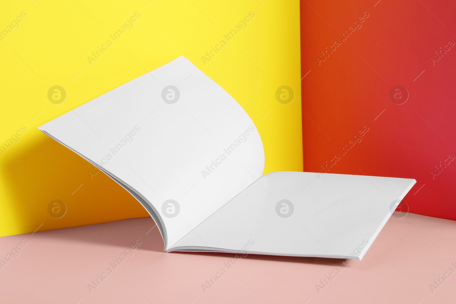 Photo of Empty book pages on color background. Mockup for design