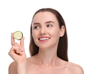 Beautiful woman with piece of cucumber on white background