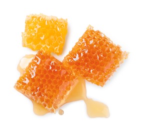 Photo of Natural honeycombs with tasty honey isolated on white, top view