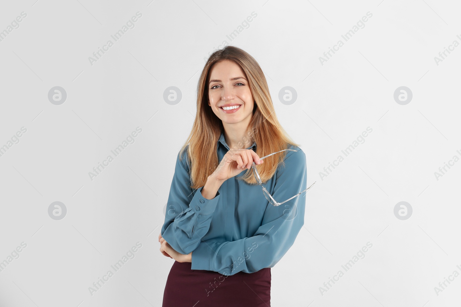 Photo of Portrait of beautiful young businesswoman on white background