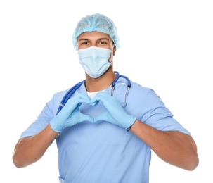 Photo of Doctor or medical assistant (male nurse) making heart with hands on white background