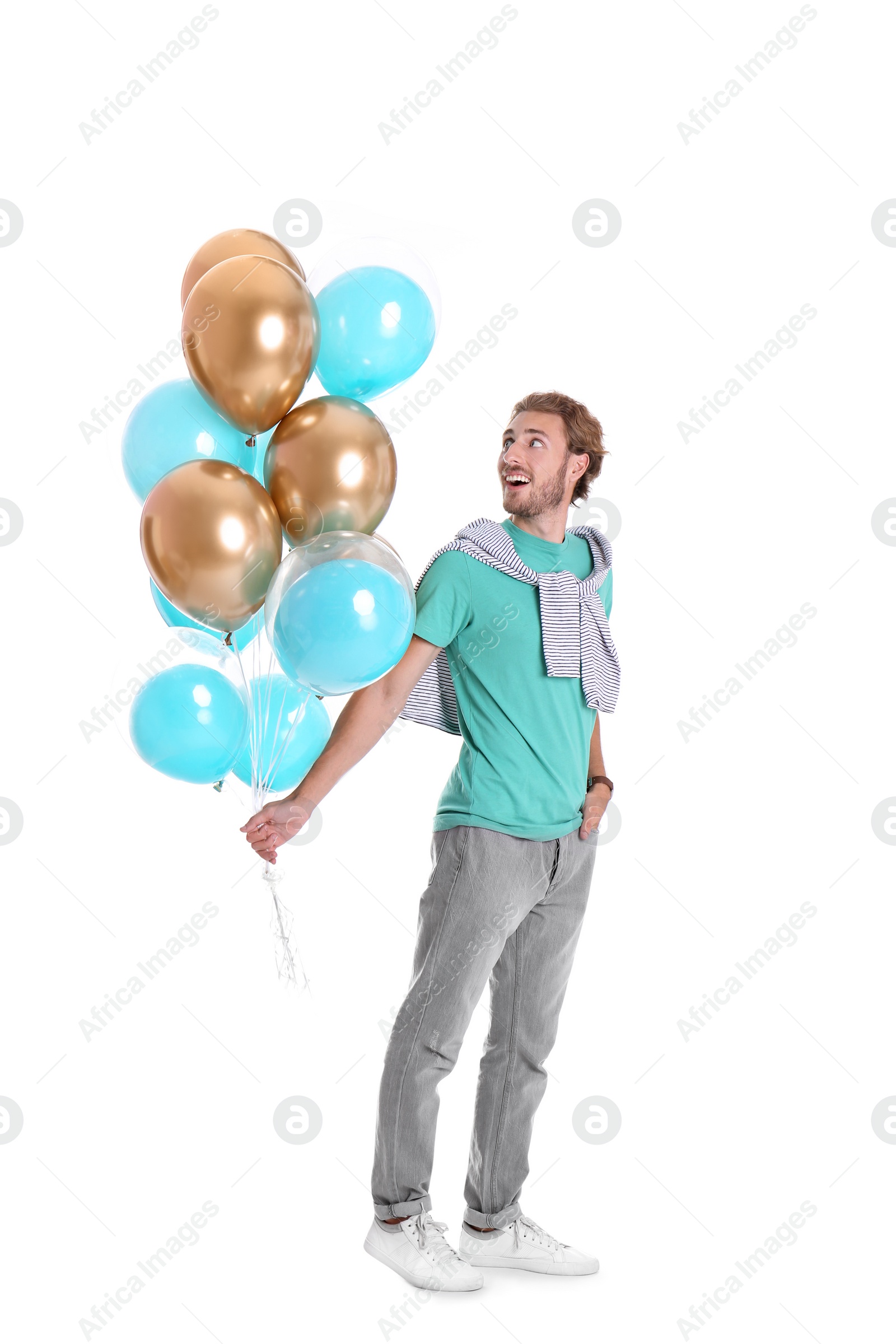 Photo of Young man with air balloons on white background