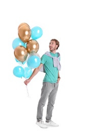 Photo of Young man with air balloons on white background