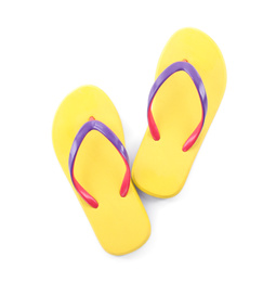 Photo of Pair of stylish yellow flip flops isolated on white, top view. Beach object