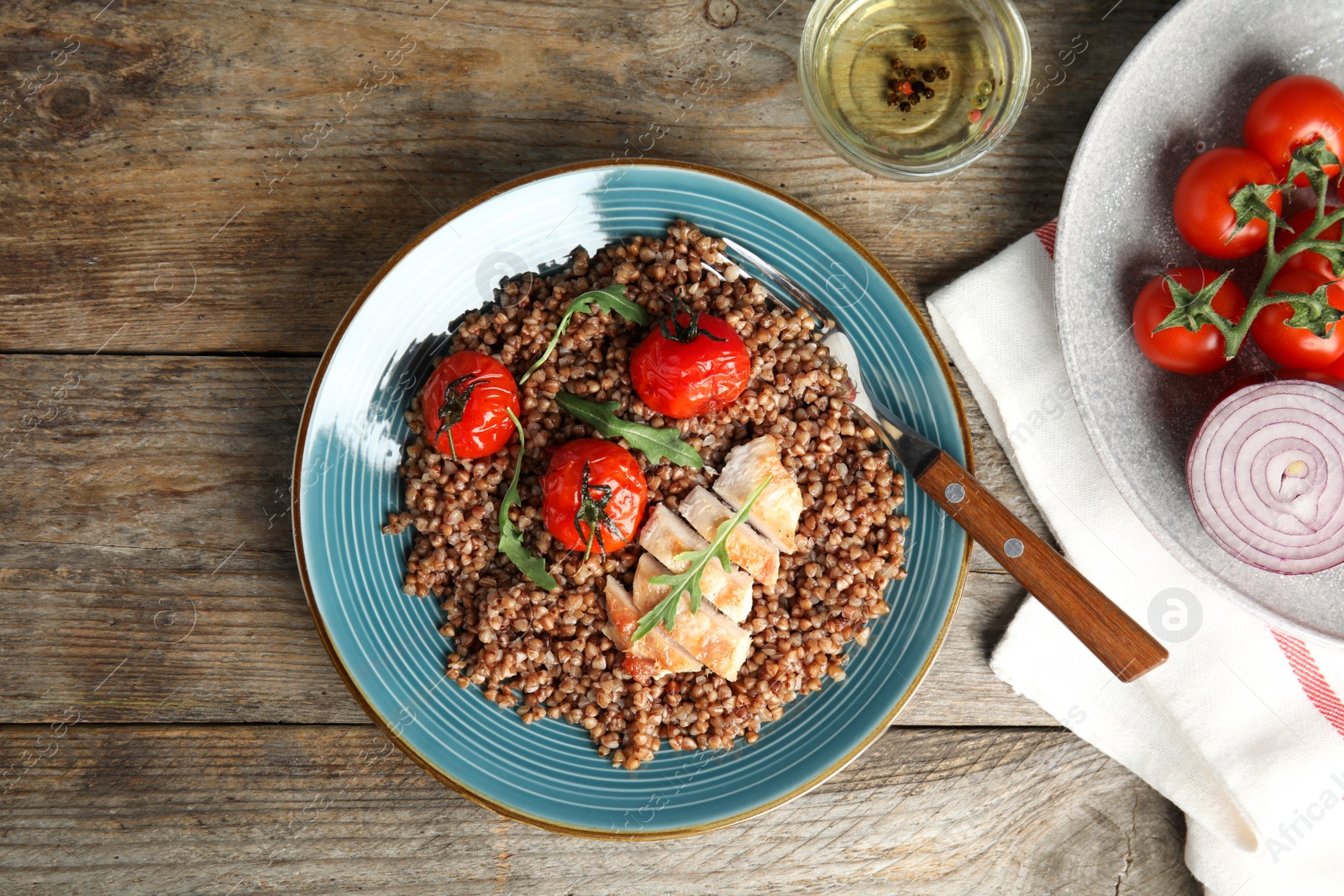 Photo of Flat lay composition with tasty buckwheat porridge on wooden table