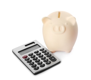 Piggy bank with calculator isolated on white