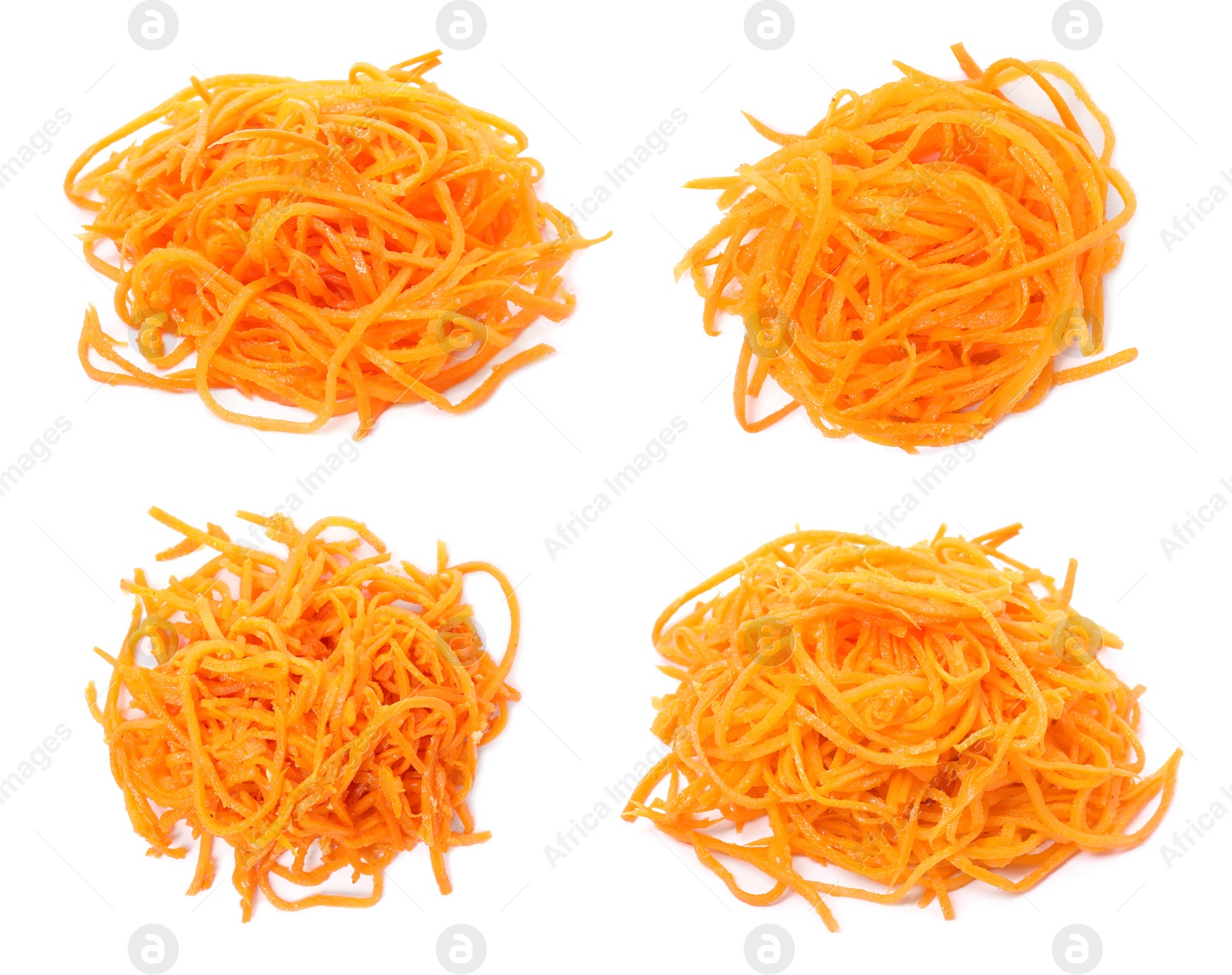 Image of Set with tasty Korean carrot salad on white background, top view